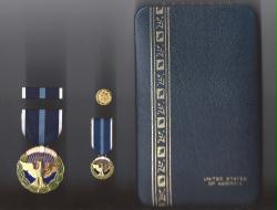 Presidential Citizens Award medal in case with ribbon bar and mini medal